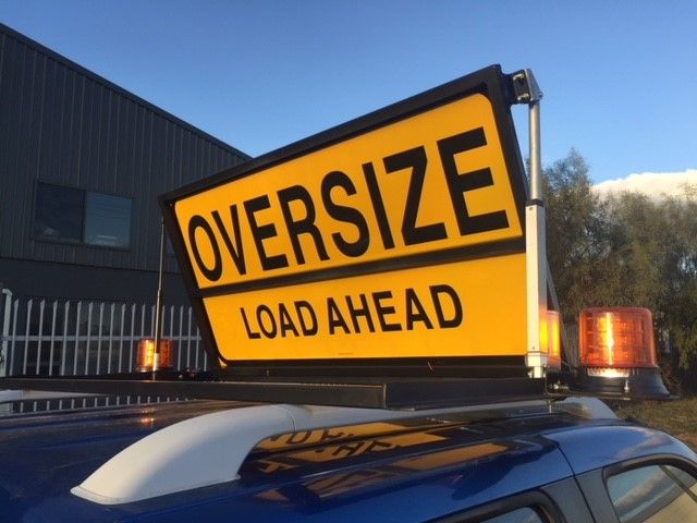 Ultimax Industries RoadBase Oversize Load Ahead Pilot Vehicle Sign Kit Motorised Version with LED Beacons and Folding Sign Mounted on Ute