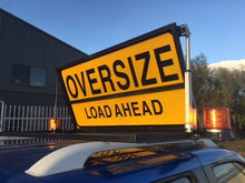 Load image into Gallery viewer, Ultimax Industries RoadBase Oversize Load Ahead Pilot Vehicle Sign Kit Motorised Version with LED Beacons and Folding Sign Mounted on Ute

